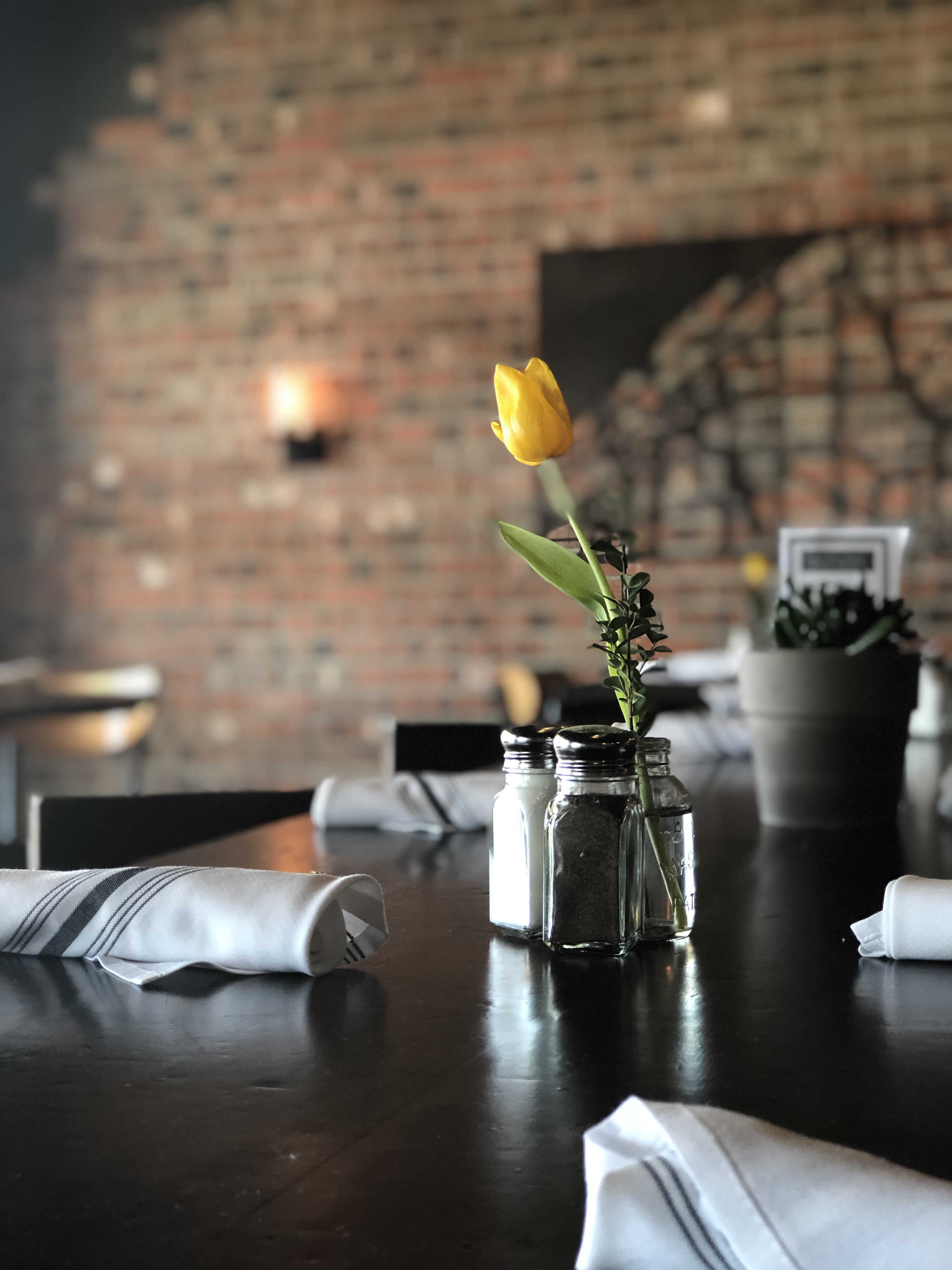 Cozy countryside dining atmosphere with fresh flowers and warm lighting